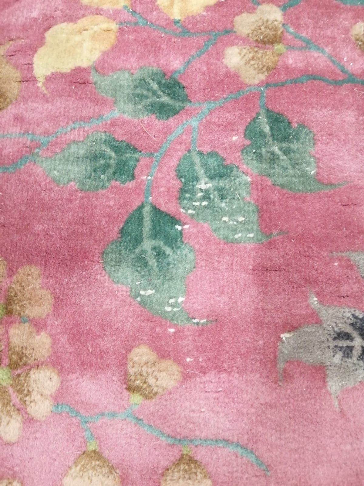 A large early 20th century Chinese cerise ground floral ground carpet, 530 x 358cm